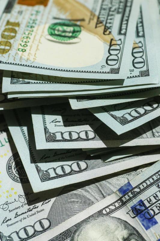 Pile of one hundred dollar bills
